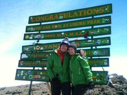 Sam Norris summiting Mount Kilimanjaro Africa